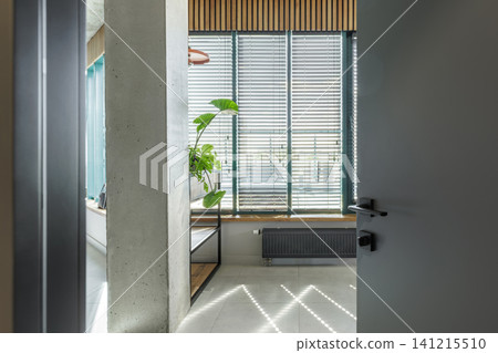 Modern Interior View through Open Door with Industrial Elements Modern Interior View through Open Door with Industrial Elements 141215510