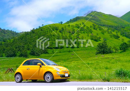 A yellow European car in the summer highlands A yellow European car in the summer highlands 141215517