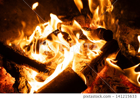 Close-up of Logs Burning with Intense Yellow and Orange Flames. Close-up of Logs Burning with Intense Yellow and Orange Flames. 141215633