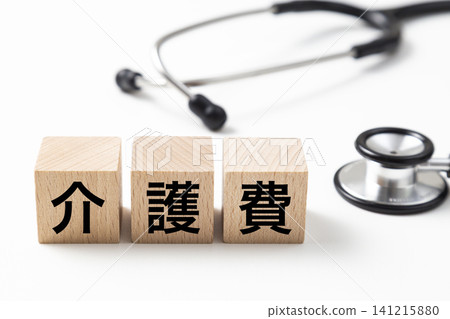 A block labeled "Nursing Care Expenses" and a stethoscope. A block labeled "Nursing Care Expenses" and a stethoscope. 141215880