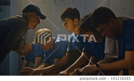 Disappointed Sports Mentor Reprimanding Teenage Team After Failed Match Disappointed Sports Mentor Reprimanding Teenage Team After Failed Match 141216285