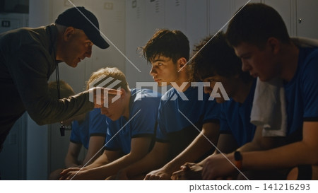 Disappointed Sports Mentor Reprimanding Teenage Team After Failed Match 141216293