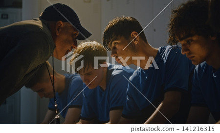 Angry Football Coach Scolding Youth Team in Locker Room After Defeat Angry Football Coach Scolding Youth Team in Locker Room After Defeat 141216315