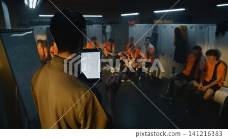 Strategic Planning in Youth Sports, Coach With Tablet Briefing Team Strategic Planning in Youth Sports, Coach With Tablet Briefing Team 141216383