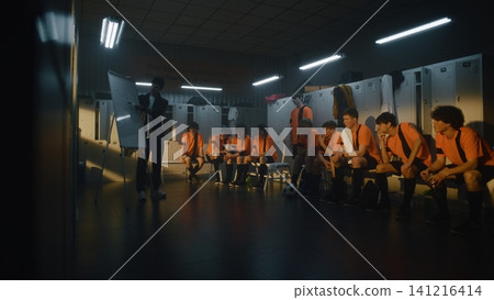 Coach Explaining Tactical Strategy on Flipchart to Teenage Football Team Coach Explaining Tactical Strategy on Flipchart to Teenage Football Team 141216414