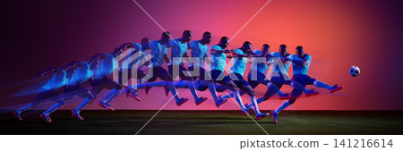 Football player accelerating into powerful strike with colorful motion sequence. 141216614