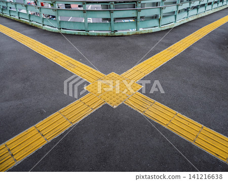 X-shaped tactile paving blocks installed on a pedestrian overpass (Kita Ward, Tokyo) X-shaped tactile paving blocks installed on a pedestrian overpass (Kita Ward, Tokyo) 141216638