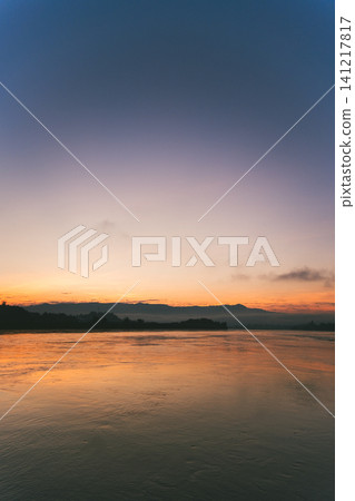 Sunrise over the Mekong River as seen from Thailand Sunrise over the Mekong River as seen from Thailand 141217817