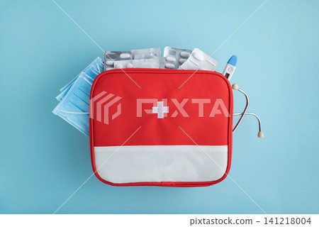 Red first aid kit with medical supplies Red first aid kit with medical supplies 141218004