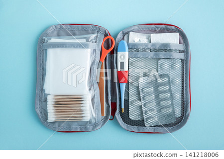 Open medical first aid kit with supplies for health Open medical first aid kit with supplies for health 141218006