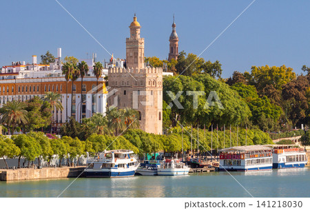 Torre del Oro and Guadalquivir River Waterfront in Seville Spain Torre del Oro and Guadalquivir River Waterfront in Seville Spain 141218030