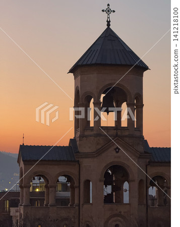 Bell tower silhouette of Holy Trinity Cathedral in Tbilisi at sunset. 141218100