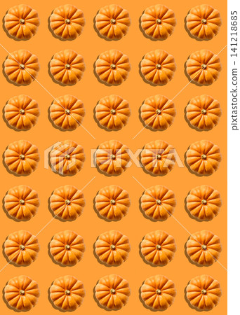 Halloween Background with Many Small Pumpkins on Orange Background, Top View Halloween Background with Many Small Pumpkins on Orange Background, Top View 141218685
