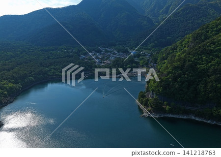 An aerial photograph capturing Lake Saiko and the mountain range in Fujikawaguchiko Town, Yamanashi Prefecture. An aerial photograph capturing Lake Saiko and the mountain range in Fujikawaguchiko Town, Yamanashi Prefecture. 141218763