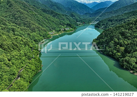 An aerial photograph overlooking Lake Ikawa and the Ikawa Bridge in Shizuoka Prefecture. An aerial photograph overlooking Lake Ikawa and the Ikawa Bridge in Shizuoka Prefecture. 141219027