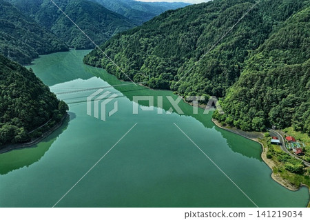 An aerial photograph overlooking Lake Ikawa and the Ikawa Bridge in Shizuoka Prefecture. An aerial photograph overlooking Lake Ikawa and the Ikawa Bridge in Shizuoka Prefecture. 141219034