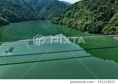 Aerial photograph capturing Lake Ikawa and the Ikawa Bridge in Shizuoka Prefecture. Aerial photograph capturing Lake Ikawa and the Ikawa Bridge in Shizuoka Prefecture. 141219057