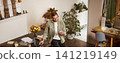 Portrait of a man in office, businessman making a phone call, having a conversation over the phone, receive a call, standing in office, leaning on table 141219149