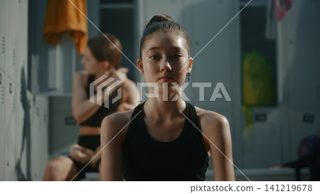 Young Gymnasts Performs Stretch While Warming Up Before Competition Young Gymnasts Performs Stretch While Warming Up Before Competition 141219678