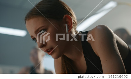 Angry and Exhausted Teen Gymnast Breathing Heavily After Hard Training Angry and Exhausted Teen Gymnast Breathing Heavily After Hard Training 141219692