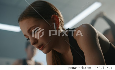Angry and Exhausted Teen Gymnast Breathing Heavily After Hard Training Angry and Exhausted Teen Gymnast Breathing Heavily After Hard Training 141219695