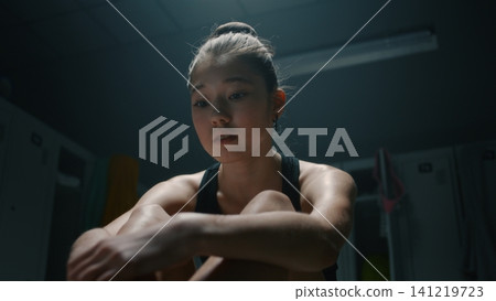 Sad Young Female Athlete Experiencing Anxiety and Stress Sad Young Female Athlete Experiencing Anxiety and Stress 141219723