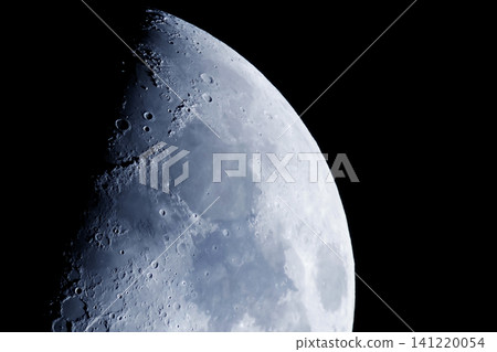 Moon dominates dark sky, detailed craters visible. Surface shows gray and blue tones. Elements of this image furnished by NASA Moon dominates dark sky, detailed craters visible. Surface shows gray and blue tones. Elements of this image furnished by NASA 141220054