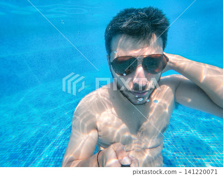UGC Style Underwater Selfie of Man with Sunglasses UGC Style Underwater Selfie of Man with Sunglasses 141220071