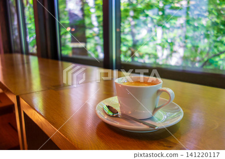 Coffee cups by the window at the Forest Cafe Coffee cups by the window at the Forest Cafe 141220117