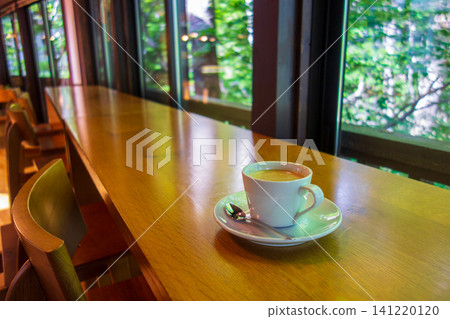 Coffee cups by the window at the Forest Cafe Coffee cups by the window at the Forest Cafe 141220120