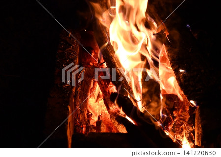 fire flames with sparks on a black background, close-up fire flames with sparks on a black background, close-up 141220630