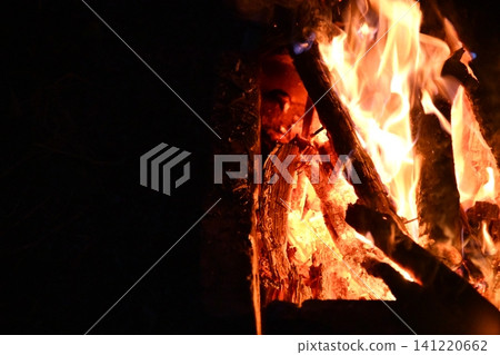 fire flames with sparks on a black background, close-up fire flames with sparks on a black background, close-up 141220662
