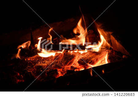 fire flames with sparks on a black background, close-up fire flames with sparks on a black background, close-up 141220683