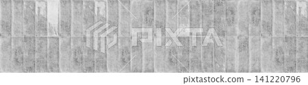 Gray weathered ceramic tiles arranged in a vertical running bond layout Gray weathered ceramic tiles arranged in a vertical running bond layout 141220796