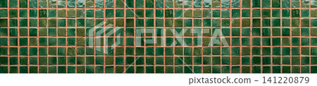 Emerald green glazed zellige mosaic tiles with terracotta grout lines in a seamless border pattern Emerald green glazed zellige mosaic tiles with terracotta grout lines in a seamless border pattern 141220879
