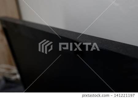 Dust piled up on top of the TV. A dirty room. It hasn't been cleaned. Dust piled up on top of the TV. A dirty room. It hasn't been cleaned. 141221197