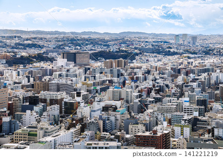 A close-up aerial view of a large city densely packed with skyscrapers and apartment buildings. A close-up aerial view of a large city densely packed with skyscrapers and apartment buildings. 141221219