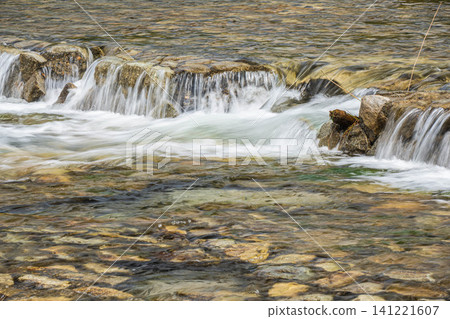 Water cascading down a weir in the Kamo River, Kyoto City 141221607
