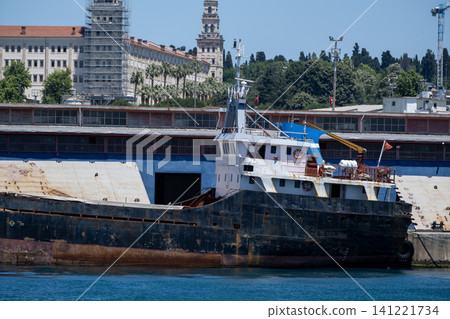 Old Rusty Cargo Ship Moored at the Harbor. Old Rusty Cargo Ship Moored at the Harbor. 141221734