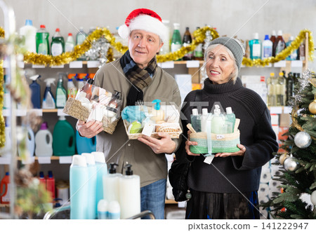 Elderly couple choosing a gift set for Christmas Elderly couple choosing a gift set for Christmas 141222947