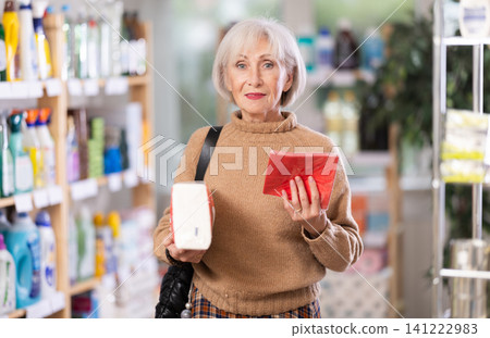Woman choosing paper napkins Woman choosing paper napkins 141222983