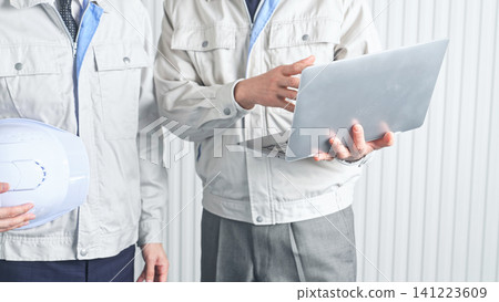 A group of male workers in a meeting. Construction, engineering, factory, contractors, consultation, meeting, DX, repair, inspection, architecture, interior. A group of male workers in a meeting. Construction, engineering, factory, contractors, consultation, meeting, DX, repair, inspection, architecture, interior. 141223609