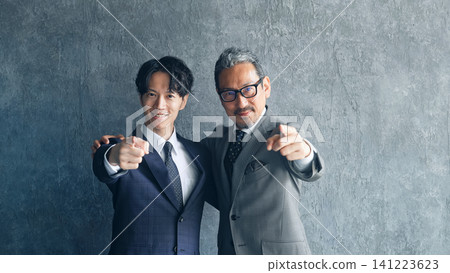 A group of male business people pointing. Goals, teamwork, challenges, boss, subordinates, company, human resources. A group of male business people pointing. Goals, teamwork, challenges, boss, subordinates, company, human resources. 141223623