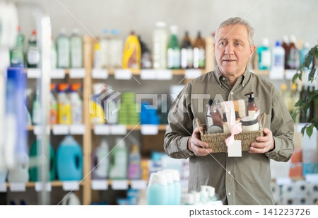 Elderly man choosing a bath gift set Elderly man choosing a bath gift set 141223726