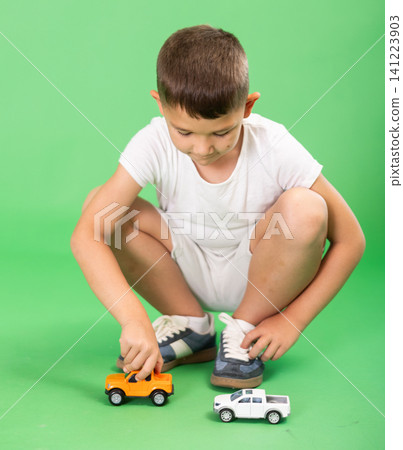 Boy with toy cars Boy with toy cars 141223903