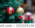 Christmas balls hanging on tree. 141224138