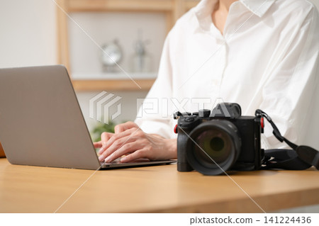 A woman editing photos A woman editing photos 141224436