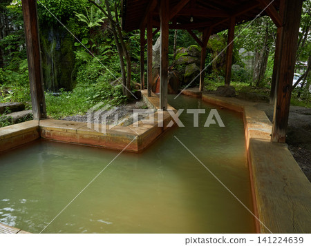 A scene of footbaths in Hirayu Onsen, a popular summer tourist spot. A scene of footbaths in Hirayu Onsen, a popular summer tourist spot. 141224639
