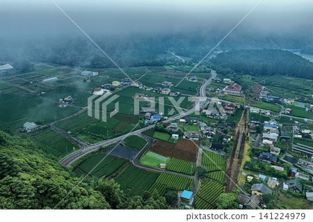 Aerial photograph capturing tea plantations and villages in Shizuoka Prefecture amidst the morning mist. Aerial photograph capturing tea plantations and villages in Shizuoka Prefecture amidst the morning mist. 141224979