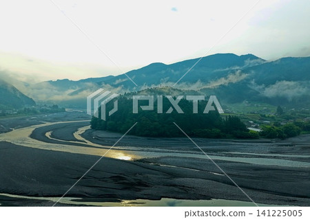 A dawn aerial photograph capturing a sandbar and a forest island in the Oi River, Shizuoka Prefecture. A dawn aerial photograph capturing a sandbar and a forest island in the Oi River, Shizuoka Prefecture. 141225005